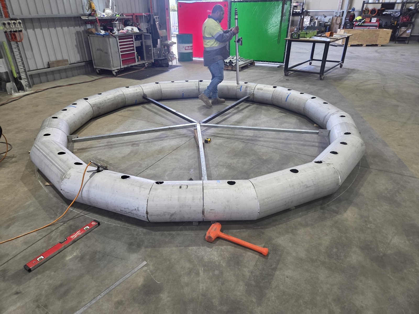 Segmented stainless kiln duct ring being set out in the workshop