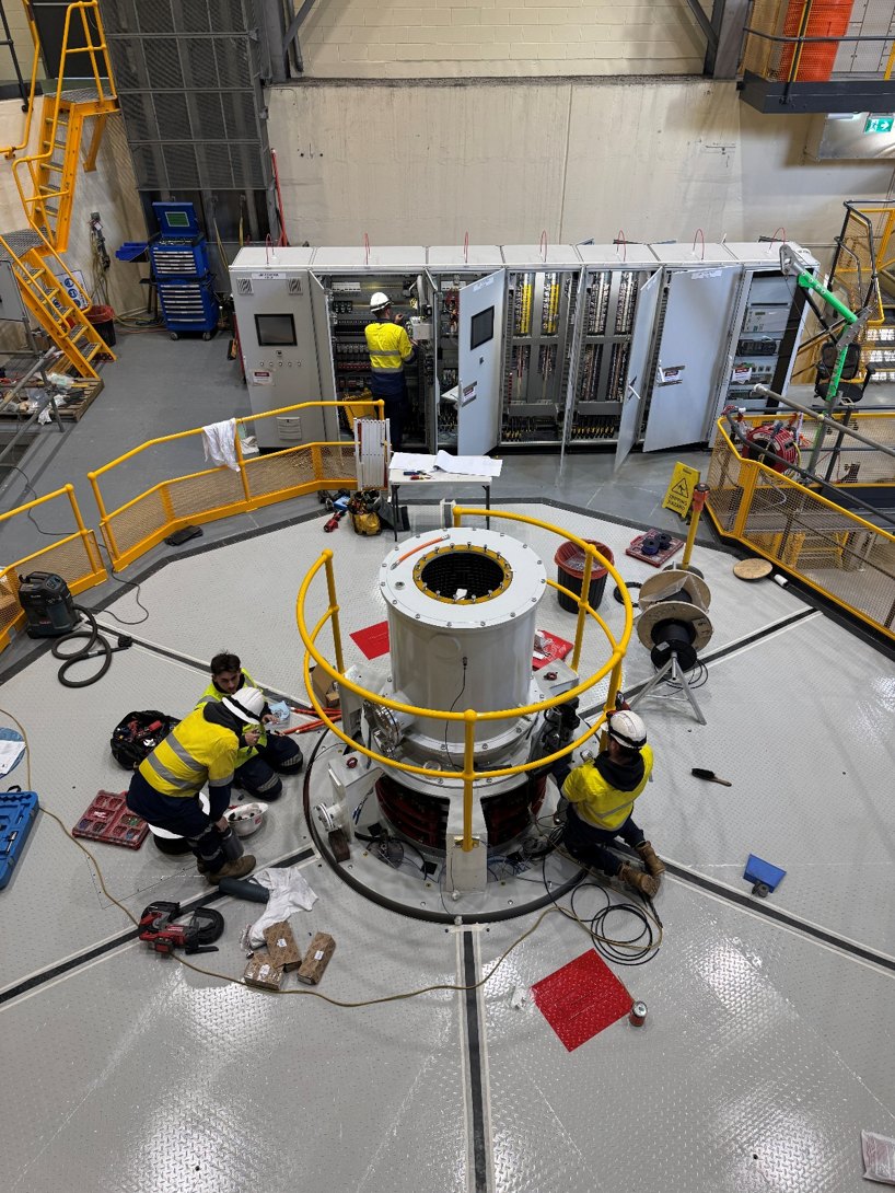 Crew working on the generator and control panels at Lemonthyme Power Station